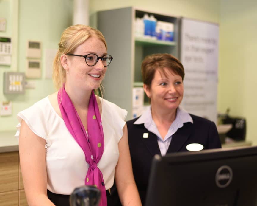 Specsavers female staff smiling